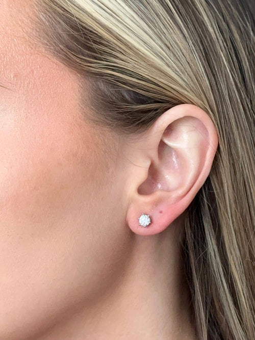 Model wearing the 0.5 carat moissanite stud earrings