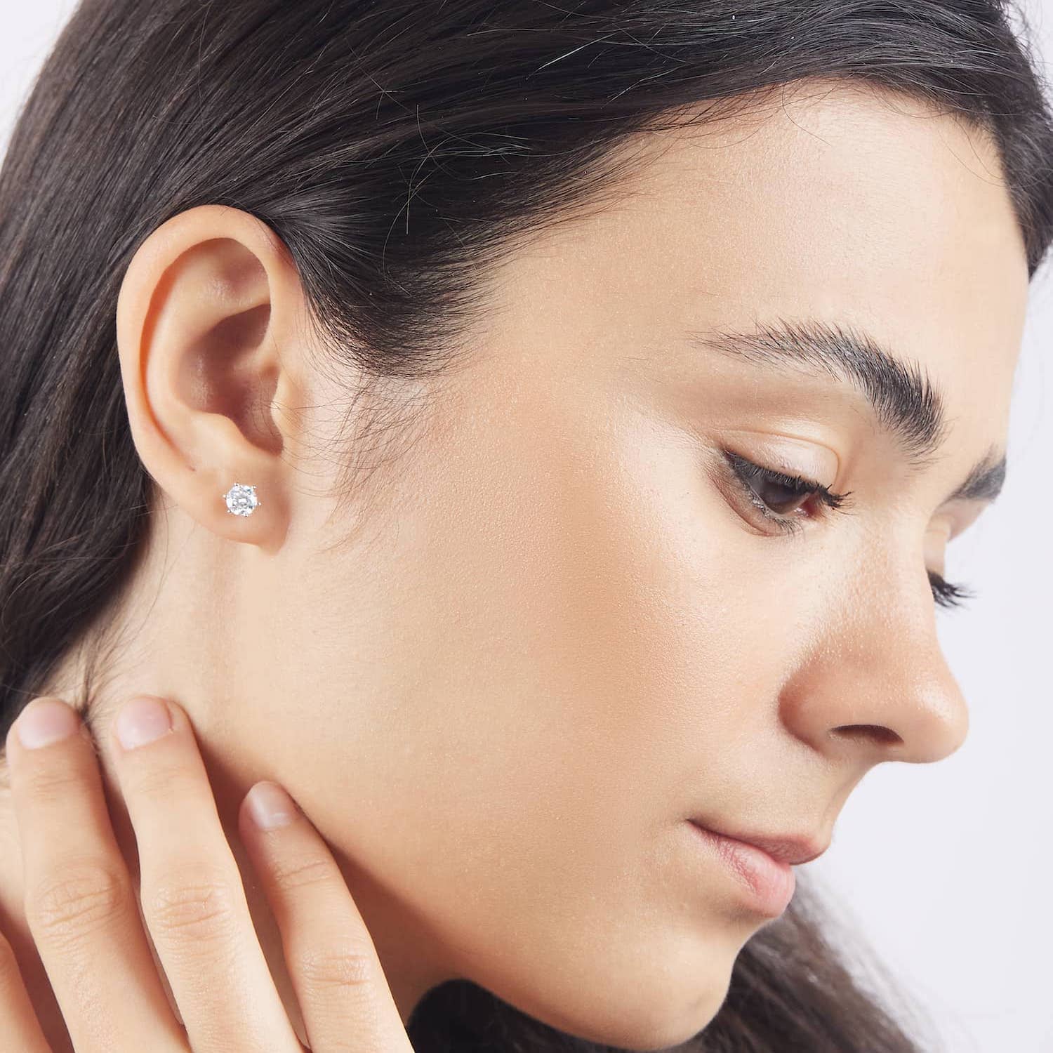 Model wearing the 0.5 carat moissanite stud earrings