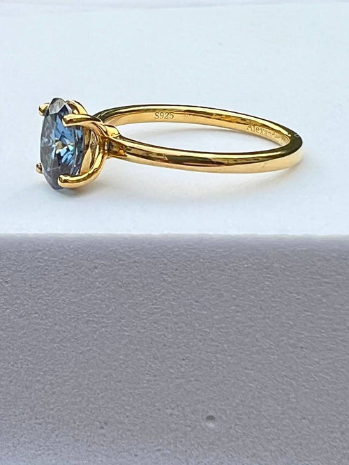 side view of blue gray moissanite ring