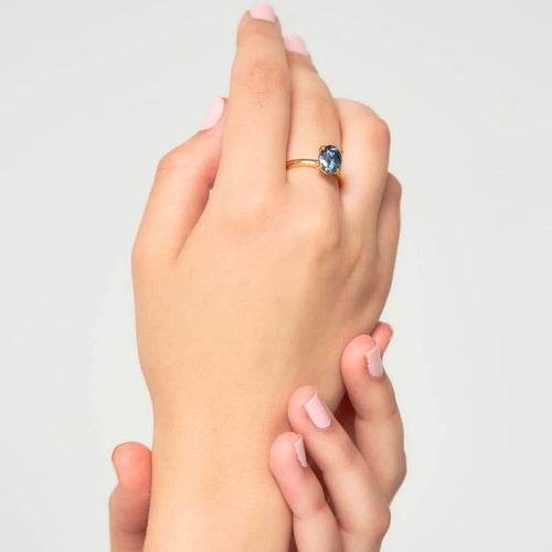 Model wearing the blue gray moissanite ring