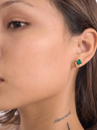 Model wearing the emerald green dress earrings