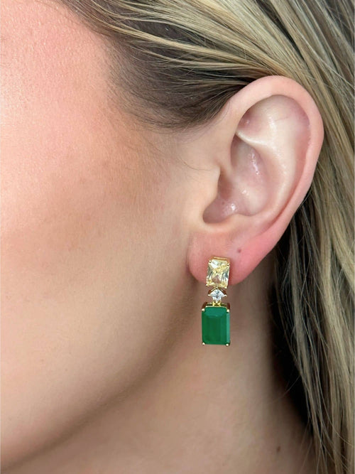 Model wearing the emerald statement earrings