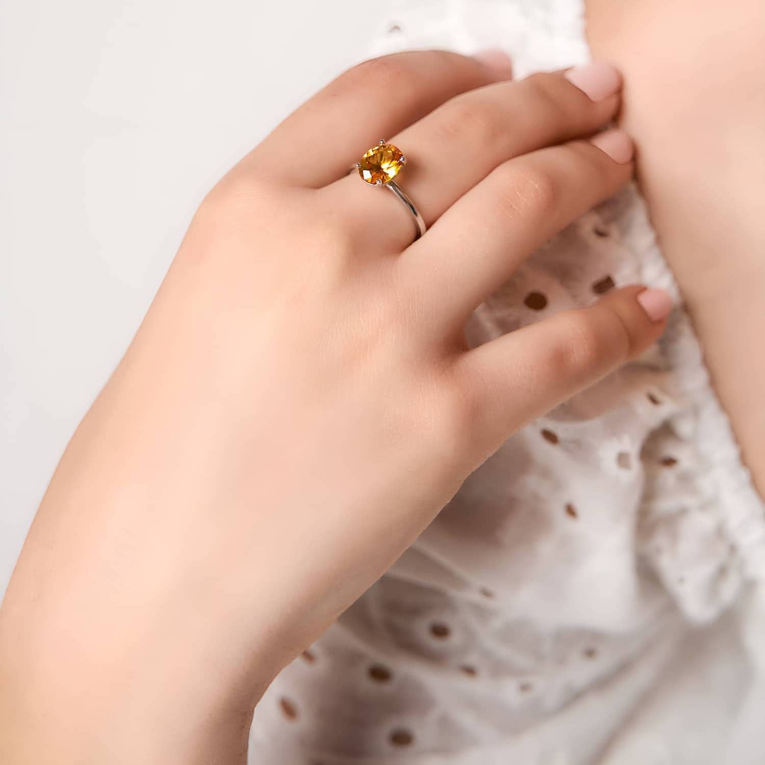 Model wearing the golden sapphire ring