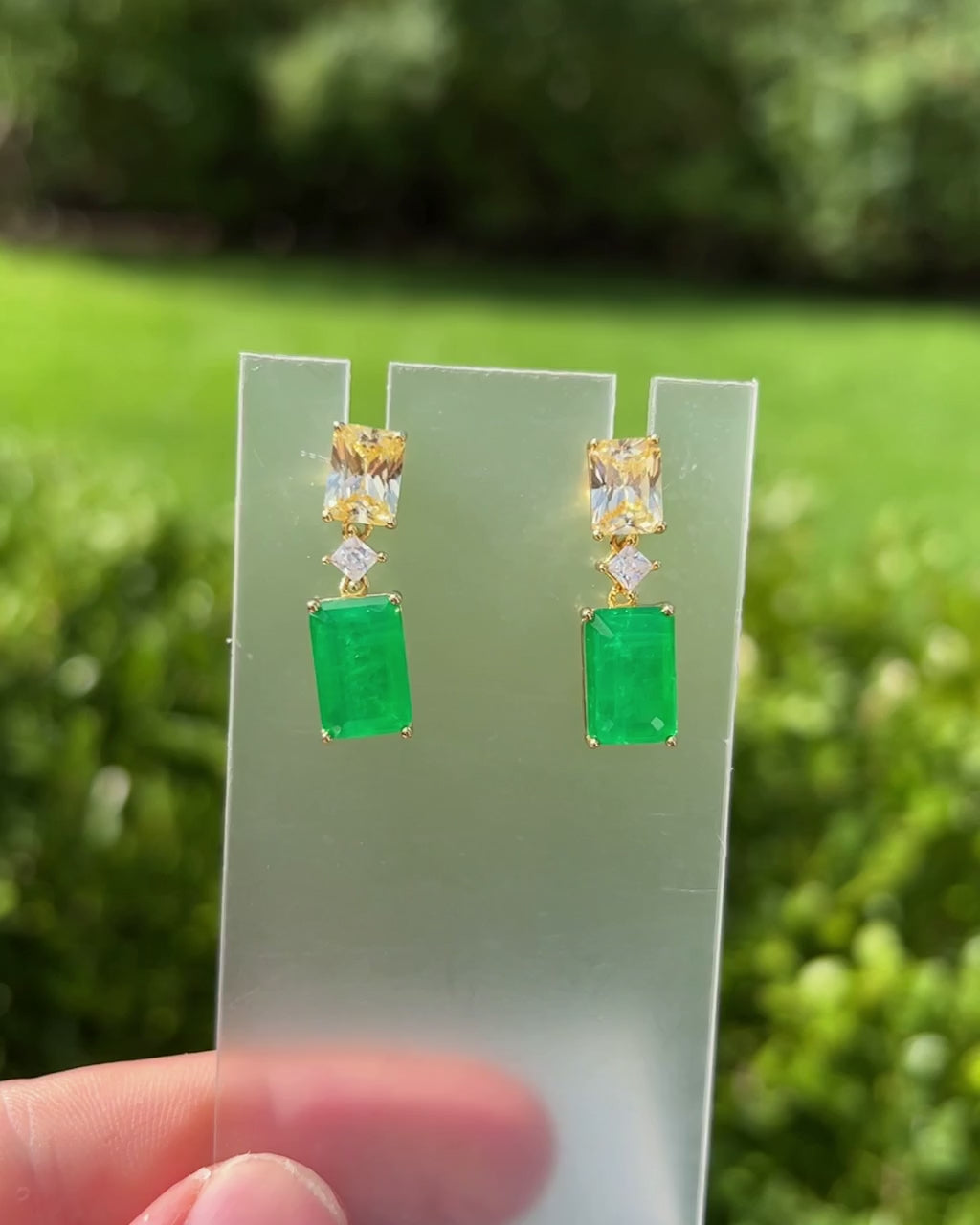 Front view of the emerald statement earrings