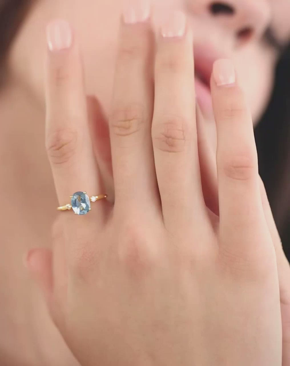 Model wearing the blue spinel ring