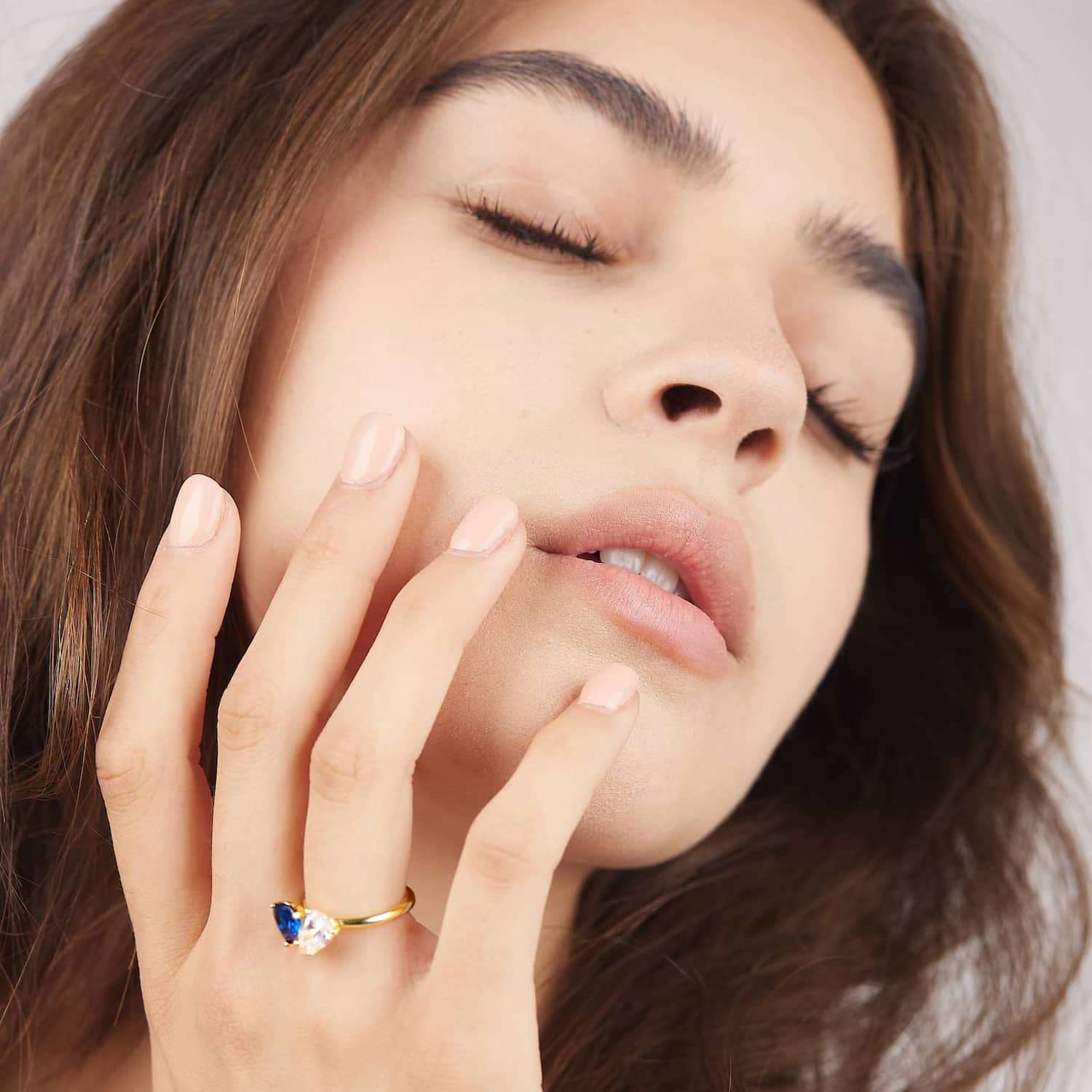 Model wearing the two stone ring in blue