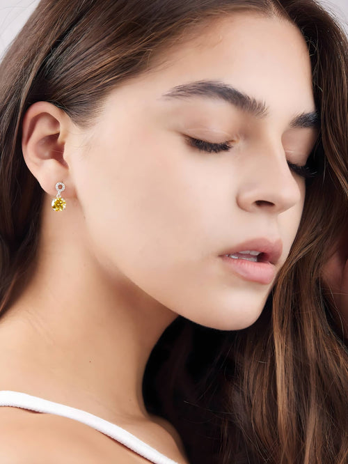Model wearing the colorful 2 carat moissanite drop earrings in yellow|Color:Yellow