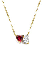 Enhanced view of the two stone necklace with a red heart gemstone in 14 karat yellow gold|Color:Red